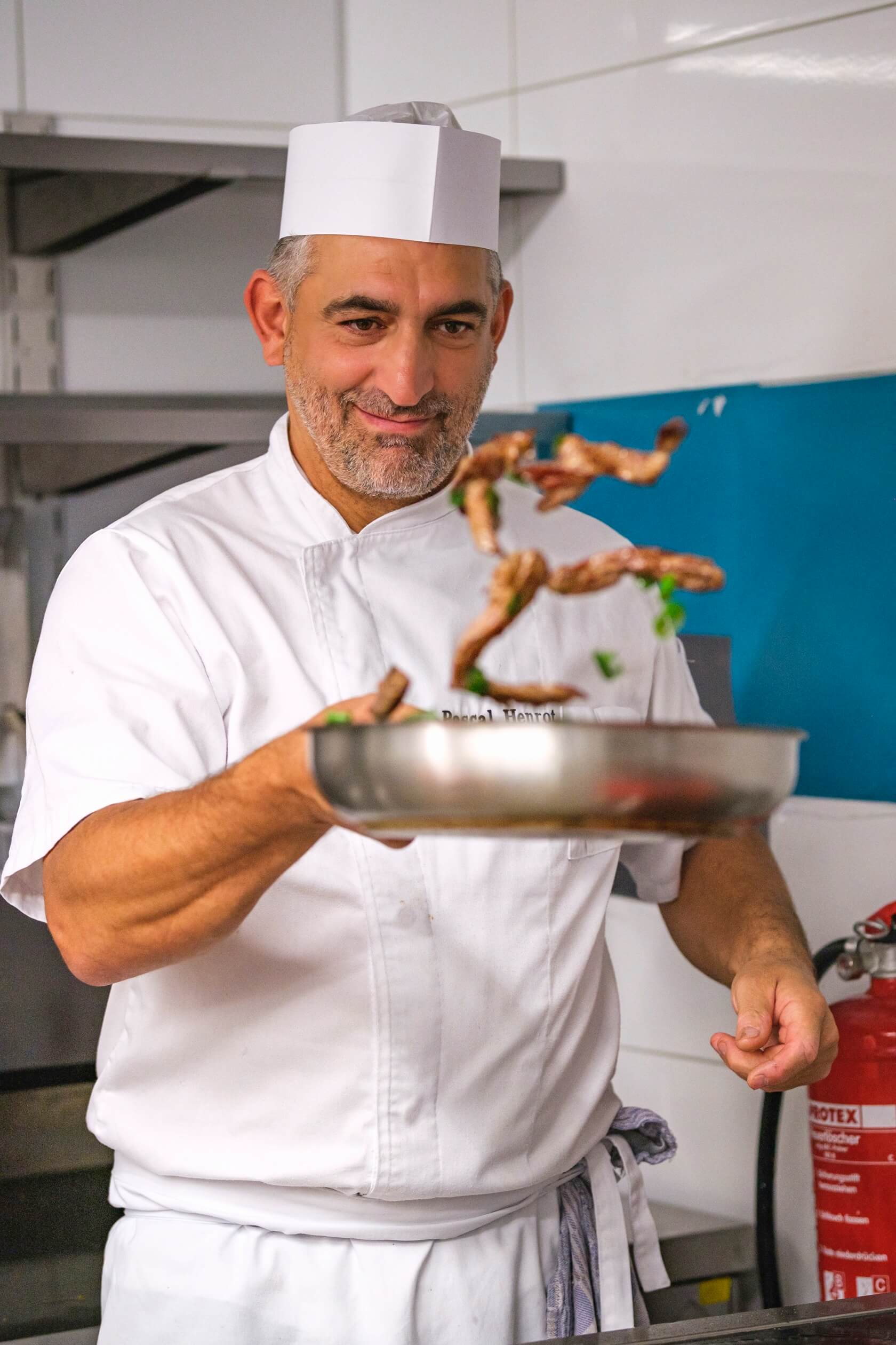 chef-pascal-henrot-frying-food-foozo-kitchen